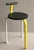 Tripod stool with a backrest, made of folded lacquered metal in yellow, white and black for the backrest and base,...