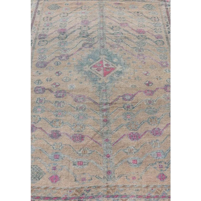 Measures: 4'10 x 7'4 Vintage Persian Shiraz with Tribal Design in Soft Yellow, Pink, and Blue Gray. Keivan Woven Arts /...