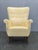 Beautiful Danish high-back wing chair produced during the 1950s. This elegant Scandinavian lounge chair embodies the...