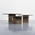 Set of three nesting tables made in Switzerland around 1970. Made of fossilized stone, they consist of square tabletops...
