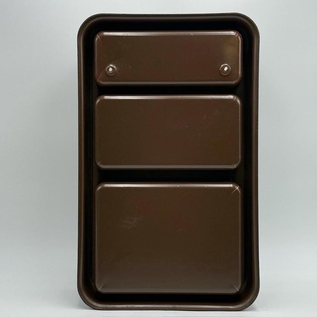 Glossy chocolate-brown Plastra wall cabinet designed by Jean-Lin Viaud for Prisunic, emblematic of French Space Age...