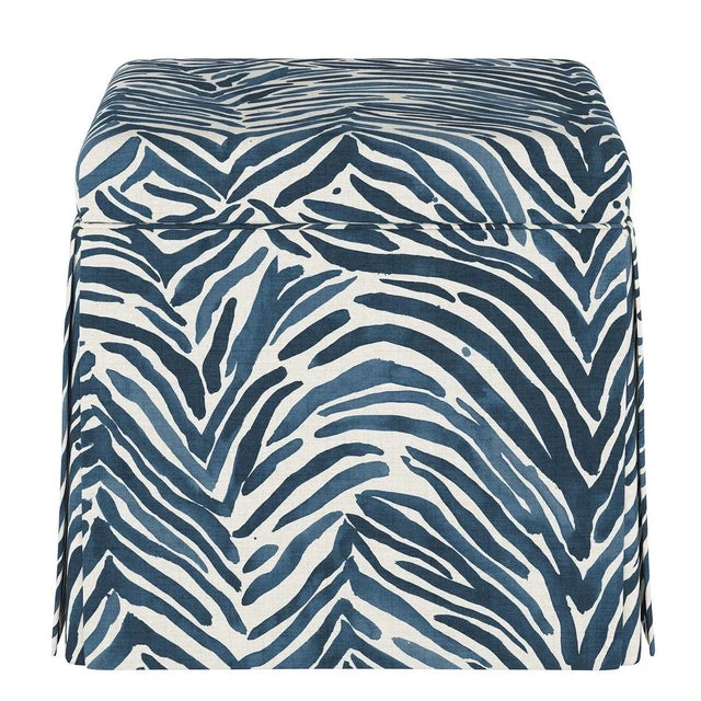 The sleek, fully upholstered design of this ottoman provides a perfect accent piece for any living room environment....