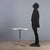 Small dining table with a circular Formica base and metal frame, as well as a metal leg. In very good condition, it bears...