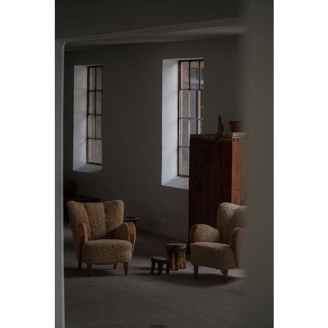 An elegant pair of Danish Art Deco lounge chairs from the 1940s, handcrafted by a skilled Danish cabinetmaker. These rare...