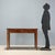 Directoire walnut desk, crafted in Italy between the late 18th and early 19th century, featuring a sober and elegant...