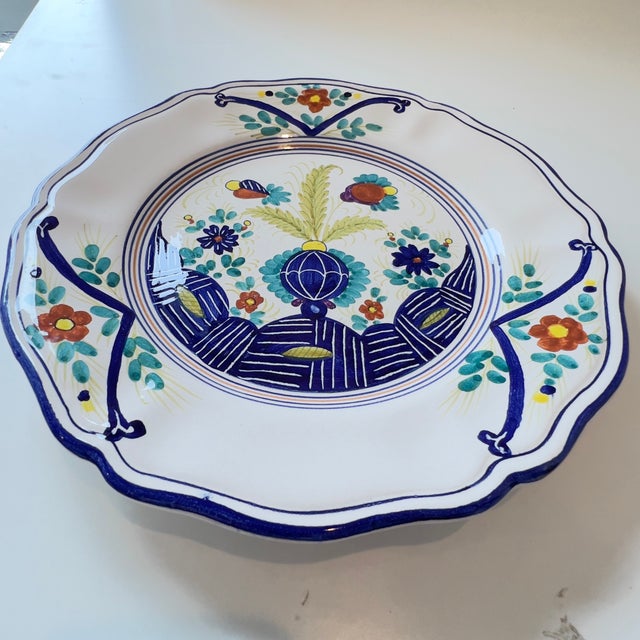 This hand-painted ceramic plate is a piece from the Faenza collection by Artistica - Deruta of Italy. This traditional...