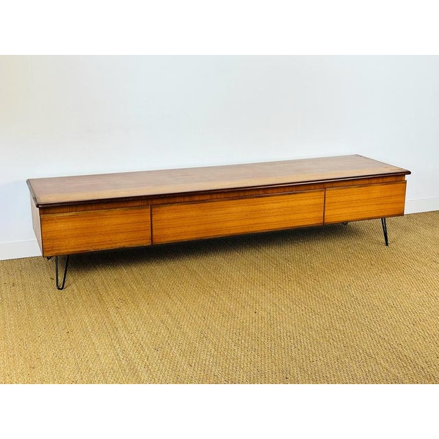 Magnificent Scandinavian teak sideboard dating from the 1960s. Comprising two drawers and a hinged door, this piece offers...