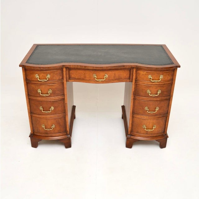 A fantastic antique burr walnut leather top pedestal desk. This is in the Georgian style, it dates from around the 1930’s....