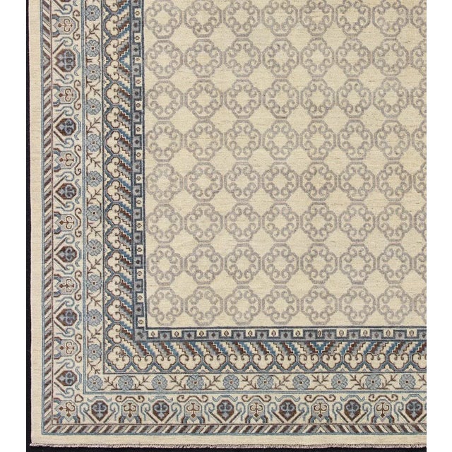 Made in Afghanistan, this rug is made with finest wool and all over tribal Khotan design in the border and the background....