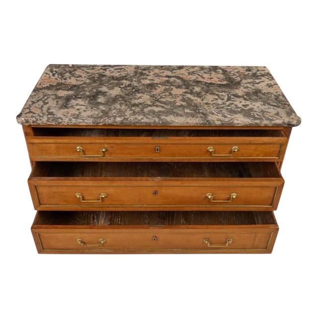This is a 19th century French neoclassical Louis XVI style marble top carved fruitwood chest or commode. The marble is...