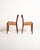 Two teak chairs with a slender frame, featuring woven rope seats and slightly curved backrests. Scandinavian production,...