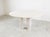 Beautiful dining table made from travertine stone with three cillindrical legs. Good looking natural travertine stone....