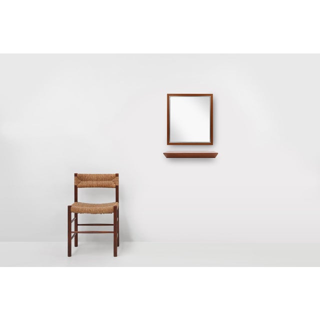 Dating back to the 1960s, this stunning mid-century modern mirror and matching floating shelf set beautifully showcases...