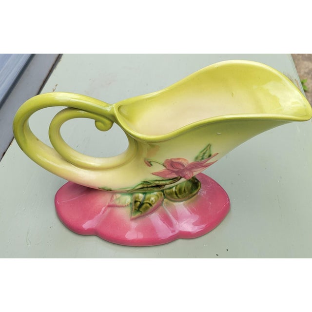 Cornucopia vase by Hull Pottery. Dimensions: 11.5 in wide x 4 in deep x 6.5 in high