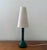 Beautiful table lamp produced by Kastrup Holmegaard, Denmark, 1960s. The lamp foot is made of organically shaped green...