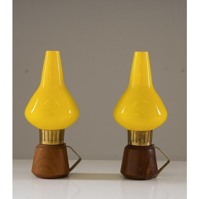 A charming pair of mid-century swedish table lamps, manufactured by asea in the 1950s. These small yet striking lamps...