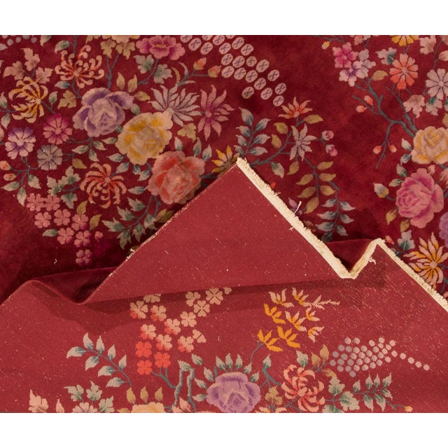 Beautiful vintage Chinese Art Deco hand-knotted wool rug with a red field and multicolor accents and all-over Chinese...