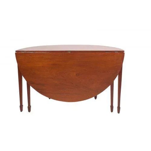 A good large George III–period mahogany demilune table, England circa 1780. The table is on square tapered legs with spade...