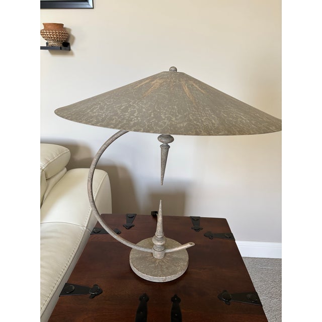 This sculptural lamp reflects the minimalist and avant-garde design aesthetics prevalent in the mid-to-late 20th century....