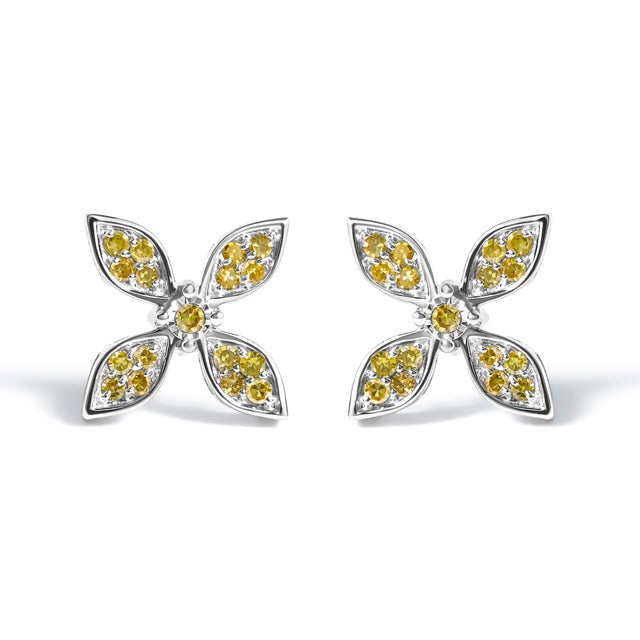Immerse yourself in the sublime radiance of these floral stud earrings, masterfully crafted from rhodium-plated .925...