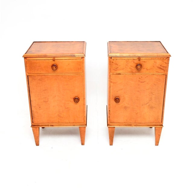 A smart and stylish pair of vintage Swedish satin birch bedside cabinets. They were recently imported from Sweden, they...