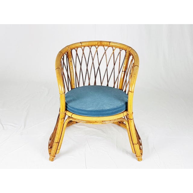This beautiful armchair was produced in Italy between the 1960s and the 1970s. It is hand-made from rush and rattan and...