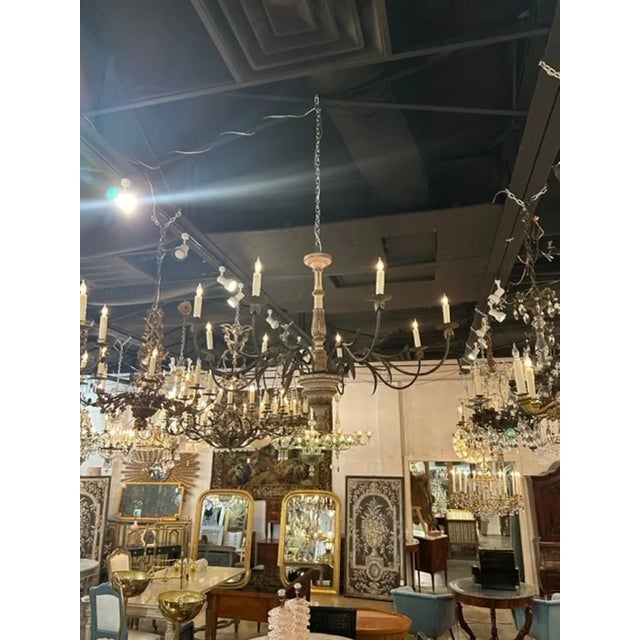 Handsome 19th century Italian carved and parcel gilt 8 arm chandeliers. Very nice patina and great scale and shape as...