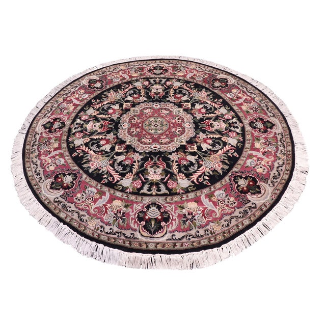 This hand‑knotted Pak Persian round rug showcases the finest expression of traditional Persian artistry. Each piece is...