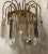 This pair of crystal prism sconces with brass frames feature E27 bulb sockets. European Plug (up to 250V).The wiring of...