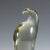 A sculpture of a stylized eagle in smoke grey glass. Hand made in the gral glass manufactory, Germany. Designed by Livio...