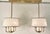 Original retail $9600, stylish Baker Modern Satin Brass Lur Double Chandelier, off-white shades with taupe bands, showroom...