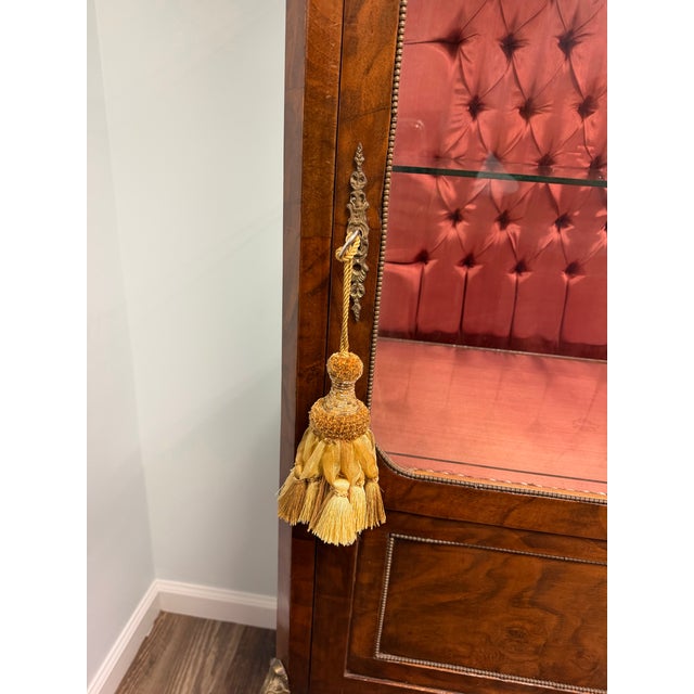 Bring unmistakable European elegance to your home with this exceptional Antique French Walnut Vitrine Cabinet, featuring...