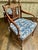 A handsome pair of Regency-style mahogany armchairs, featuring gracefully scrolled arms, tapered legs, and pierced splat...