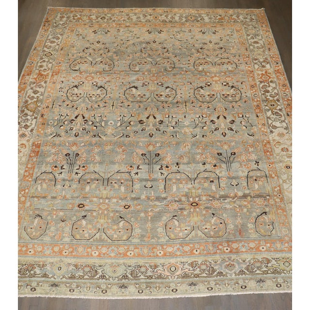 an early 20th Century Antique Malayer Room Size rug with a spiraling pattern on a neutral field