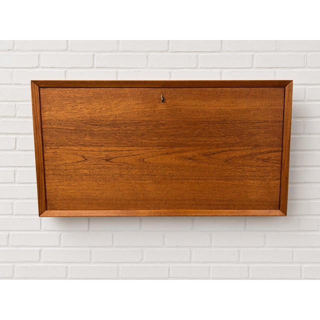 Vintage teak bar cabinet for use in the cado system, designed 1960 by poul cadovius. this cabinet is a fantastic addition...