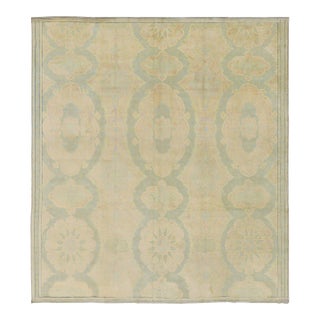 Antique 20th Century Turkish Hereke Rug in Soft Pastel Medallions - Rug & Kilim For Sale