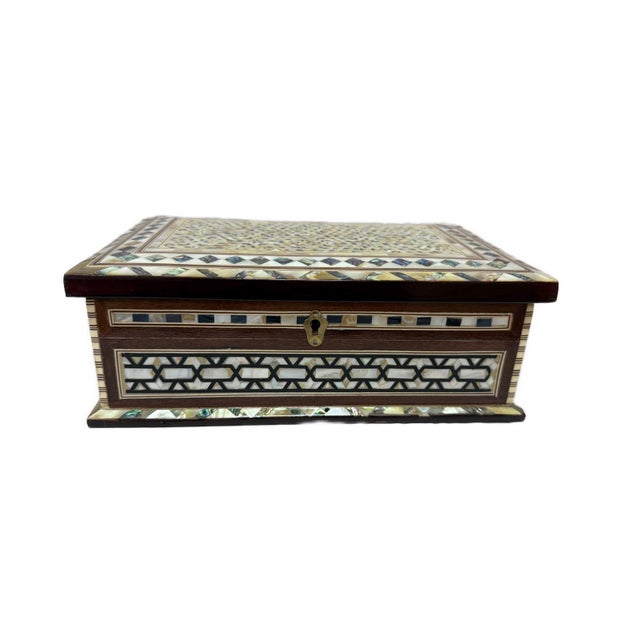 Add timeless elegance to your home with this exquisite handmade Mother of Pearl jewelry box, carefully crafted by skilled...