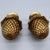 A well-matched pair of gilt brass curtain rod finials in the French Empire tradition, each featuring a finely cast...