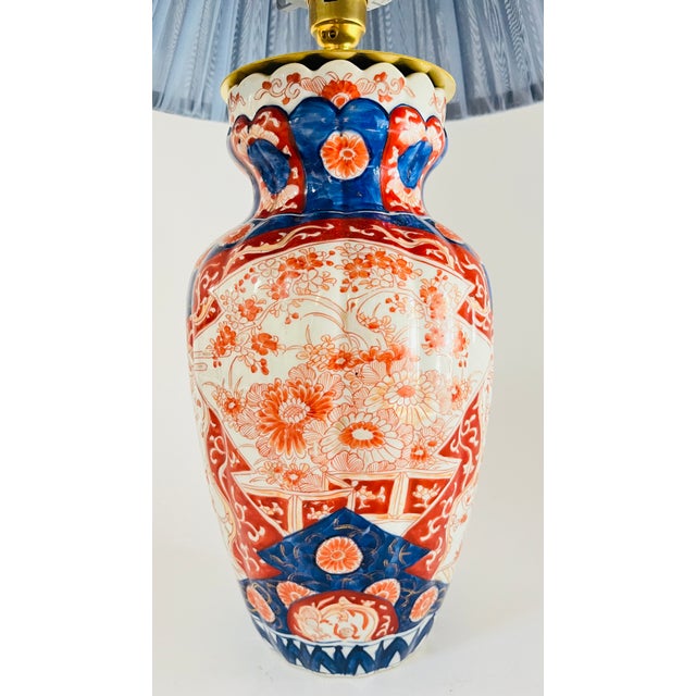 An early 20th century table lamp made from a traditional Japanese Imari vase. Decorated on an off white ground, the lamp...
