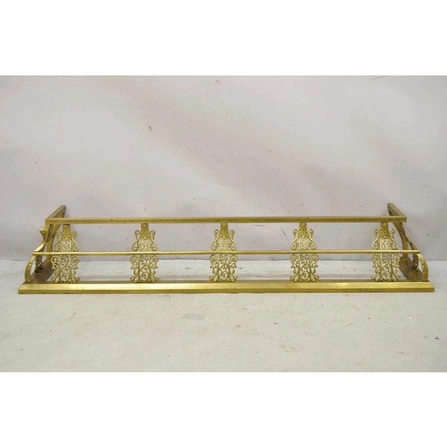 Antique Victorian Brass Scroll Accented 58" Fireplace Hearth Fender Surround. Item features pierced scroll accents...