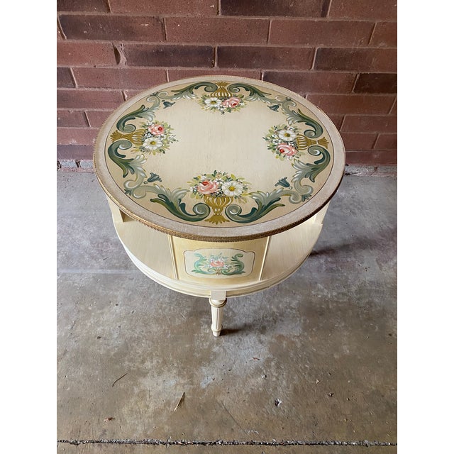 This elegant Mid 20th Century European round side table is a true work of art, featuring intricate hand-painted floral...