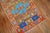 A pair of mid-20th century Turkish Anatolian rugs in bright intense colors. A multi-color repetitive box design surrounded...