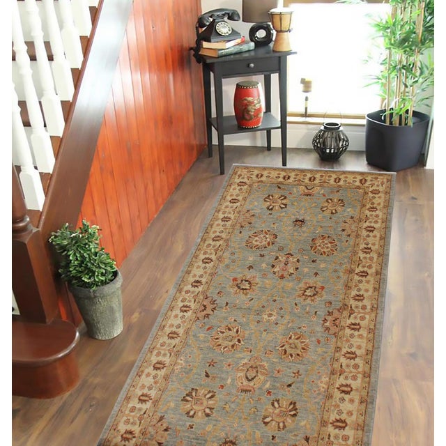 Enhance the ambiance of your home with this magnificent Persian-influenced Turkish hand-knotted rug made by skilled...