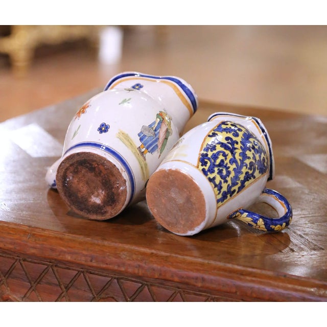 Pair of 19th Century French Quimper Faience Jugs With Breton Figures and Floral For Sale - Image 13 of 13