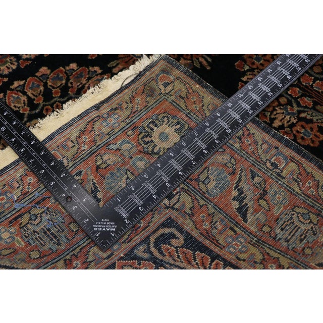 Antique Persian Sarouk Rug - 04'04 X 06'09. With its beguiling beauty and rich jewel-tones, this hand-knotted wool antique...