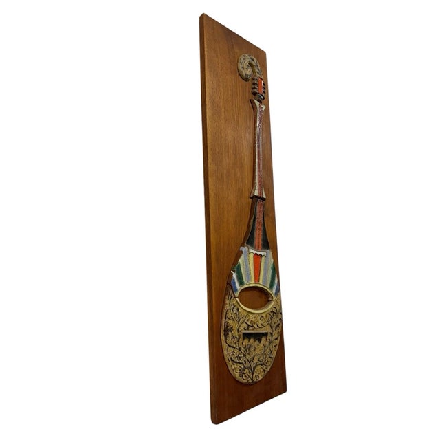 The product is a mid-century modern Harris G. Strong porcelain tile wall art guitar hanging from the 1960s, made in the...