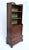 A 20th c.. Mahogany bookcase with two removable shelves and new custom lined green grasscloth interior, four dovetail...