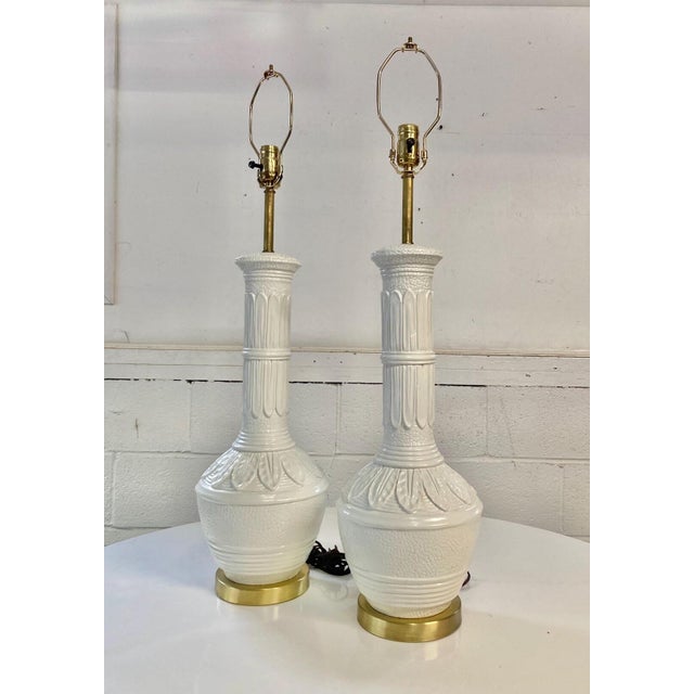 Vintage Mid Century Ceramic Table Lamps A pair of majestic vintage table lamps with palm leaf, high gloss white ceramic...
