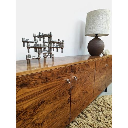 A truly stylish vintage sideboard with ample storage. Its sleek lines and beautiful wood grain make it truly stunning....
