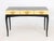 Boca Do Lobo Black Lacquer Console Table, the glass top with cut scrollwork above three gold-leaf lacquered drawers. 30.5"...